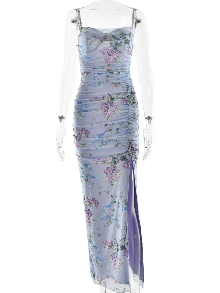 Mannequin wearing a light blue floral maxi dress with a sweetheart neckline, ruched body, and thigh-high slit.