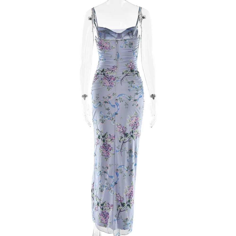 Back view of a light blue floral maxi dress on a mannequin, showcasing the full length and delicate floral pattern.