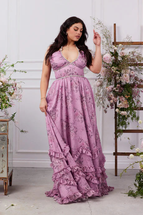 Plus size lavender floral tiered maxi dress with pearl trim, deep V-neck, and ruffled skirt.