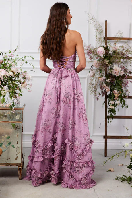 Back view of purple floral tiered maxi dress with lace-up corset bodice and cascading ruffles.