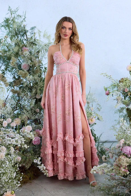 Pink floral tiered maxi dress with pearl trim, side slit, and ruffled skirt details for women.