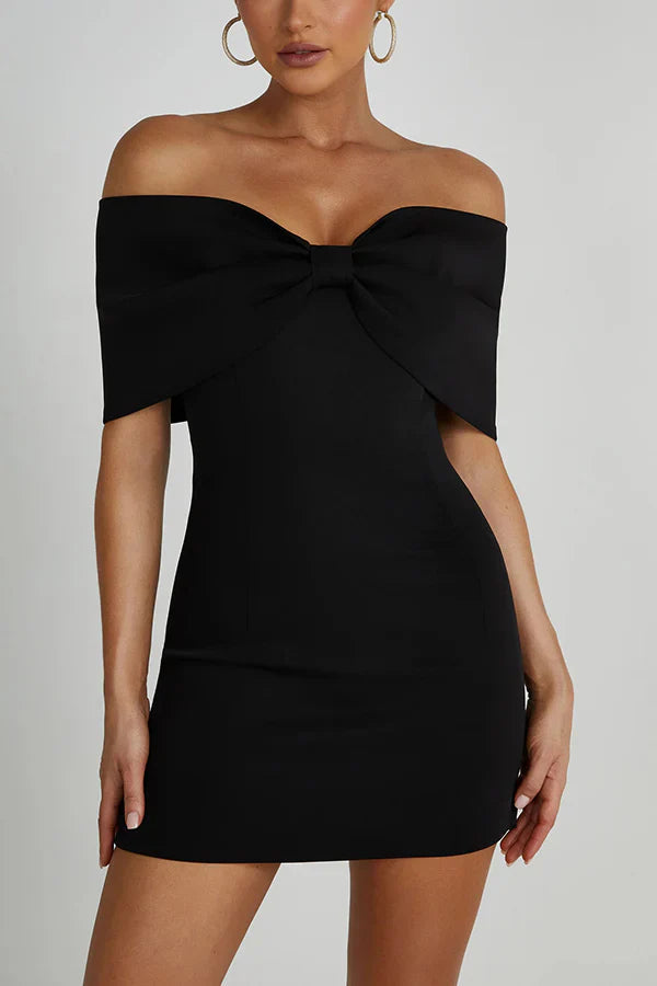 Black Freya Bow Mini Dress, off-the-shoulder design featuring a prominent bow at the neckline.