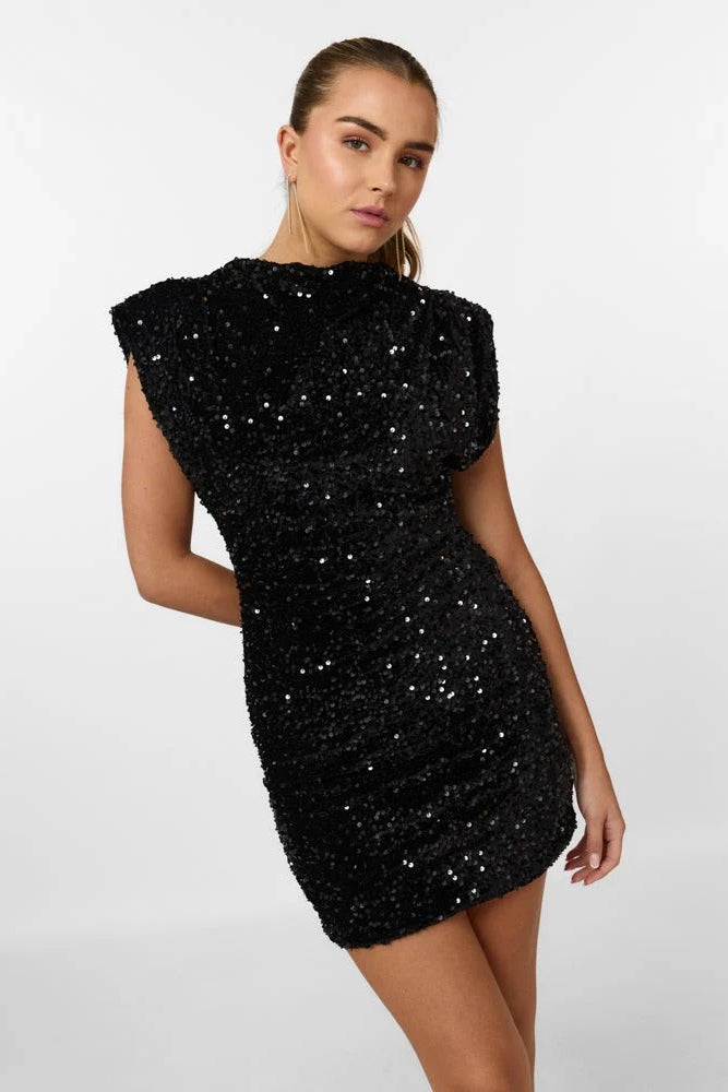 Close-up, angled view of a black sequin mini dress with cap sleeves and a mock neck, showing texture.