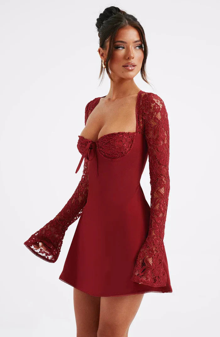 Front view of a dark red mini dress with a sweetheart neckline, lace detailing on the bust, and long bell-cuff lace sleeves.