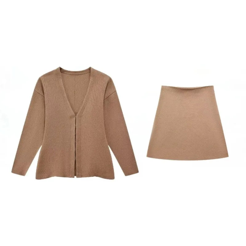 Flat lay of a light brown knit mini skirt and a matching long-sleeved v-neck cardigan, showcasing the set.