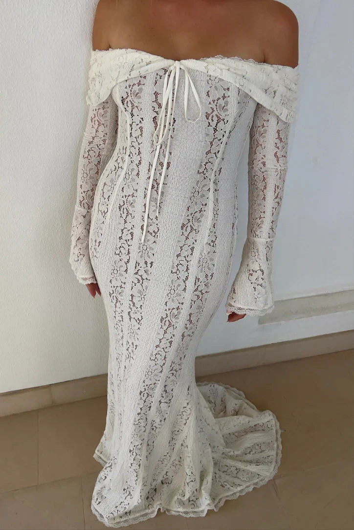 Full-length view of the white lace maxi dress, highlighting the delicate lace fabric and off-shoulder design.