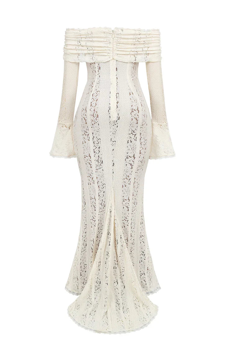 Back studio shot of the white lace maxi dress, showing the hidden zipper and flared hem with a small train.