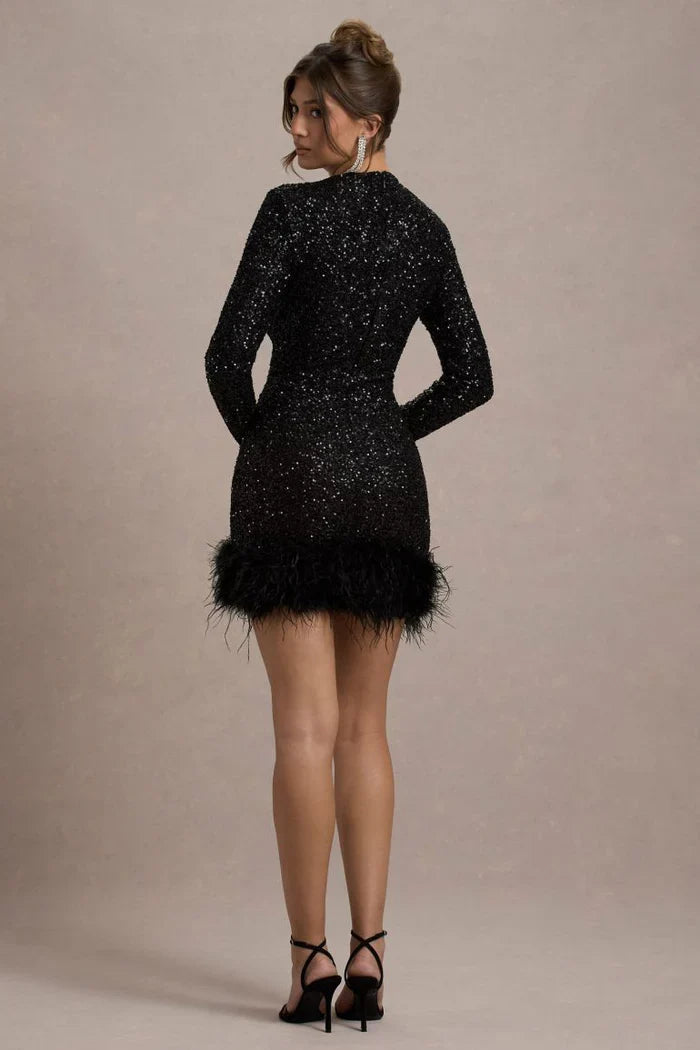 Back view of the black sequined mini dress, showcasing the long sleeves and feather-trimmed hem.