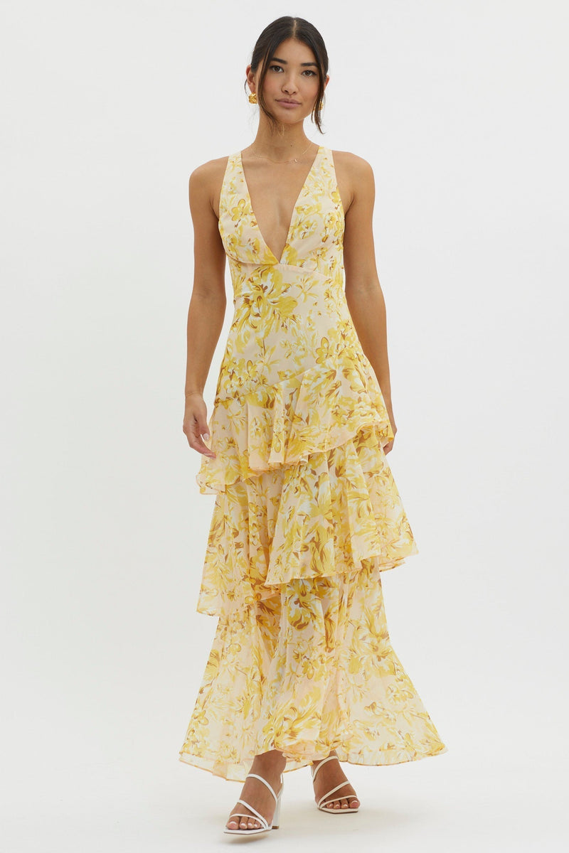 Yellow Harriet Ruffle Maxi Dress with delicate floral patterns, a deep V-neck, and flowing tiered skirt.