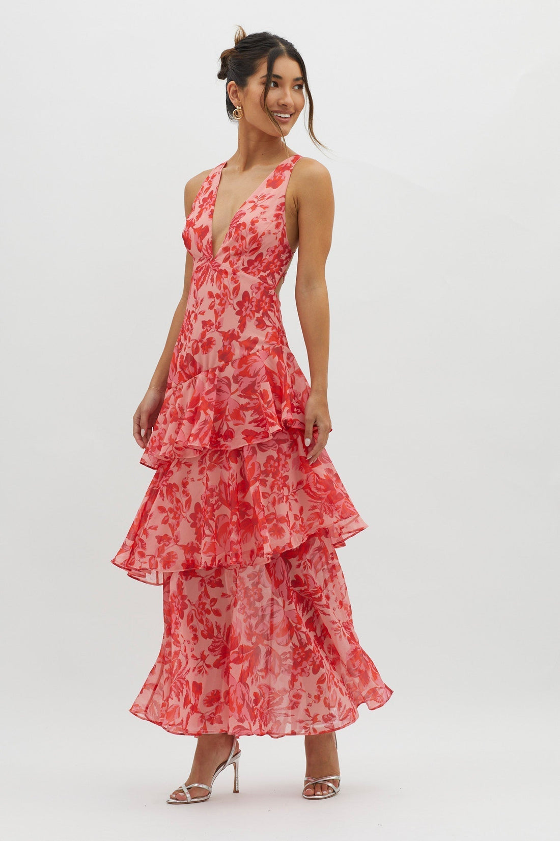 Harriet Ruffle Maxi Dress in vibrant pink and red floral print, featuring a deep V-neck and tiered ruffles.