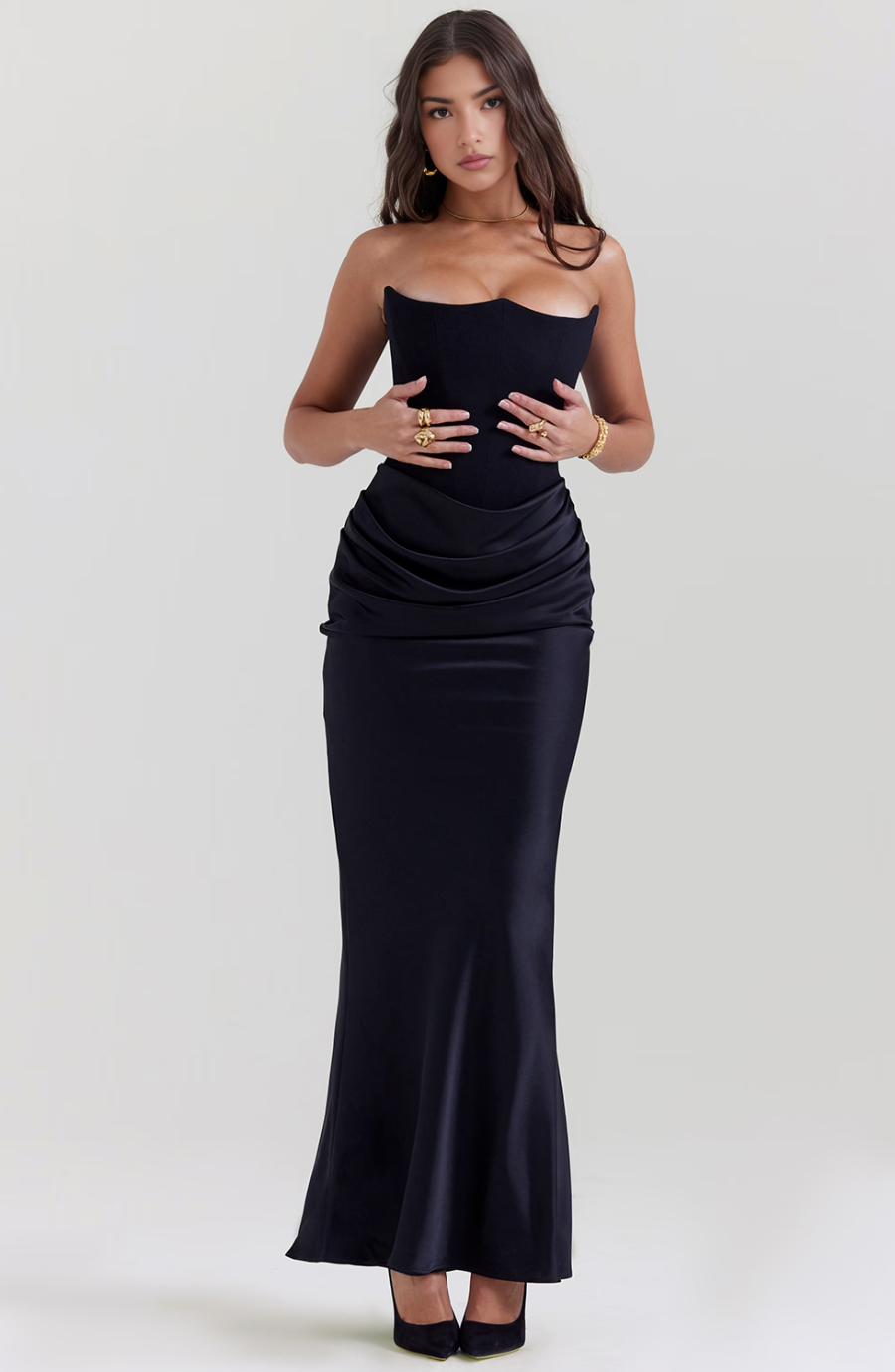 Front view of the black corset maxi dress, highlighting the sweetheart neckline and ruched waist detail.