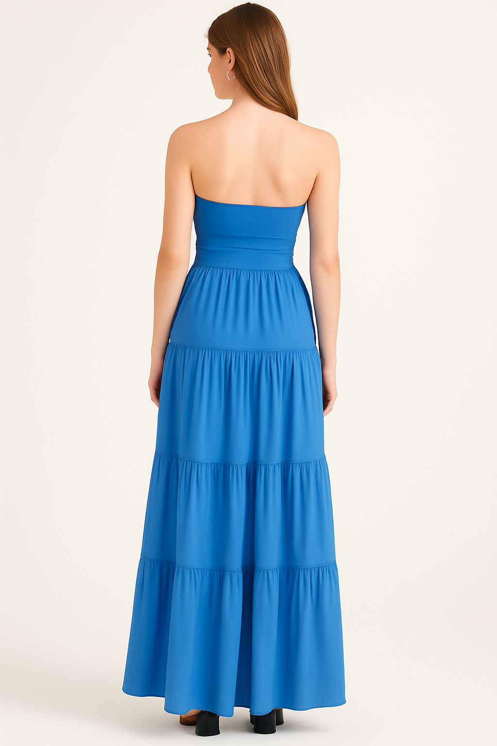 Back view of a blue strapless tiered maxi dress for women with a subtle empire waist
