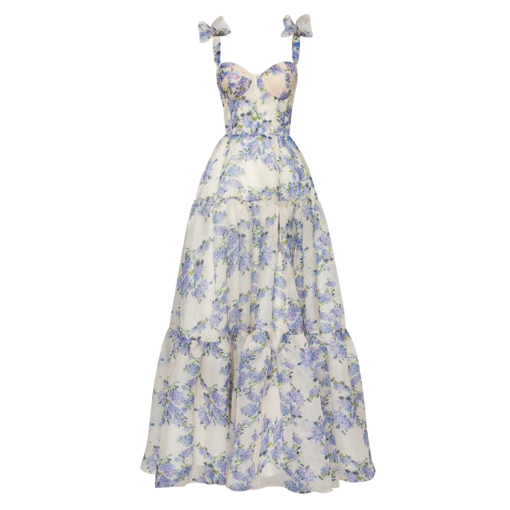 Full product shot of a white and blue floral corset maxi dress with bow straps for women