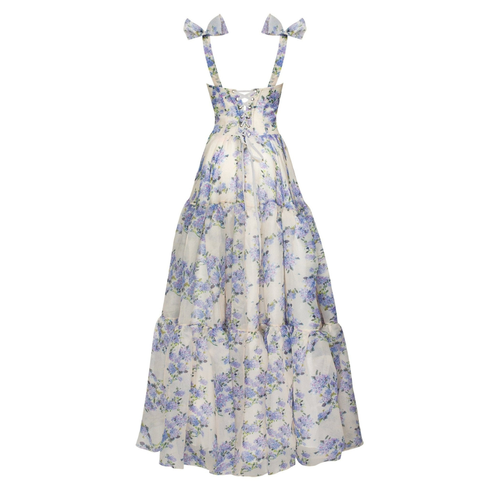 Full back view of a white and blue floral corset maxi dress with lace-up closure for women
