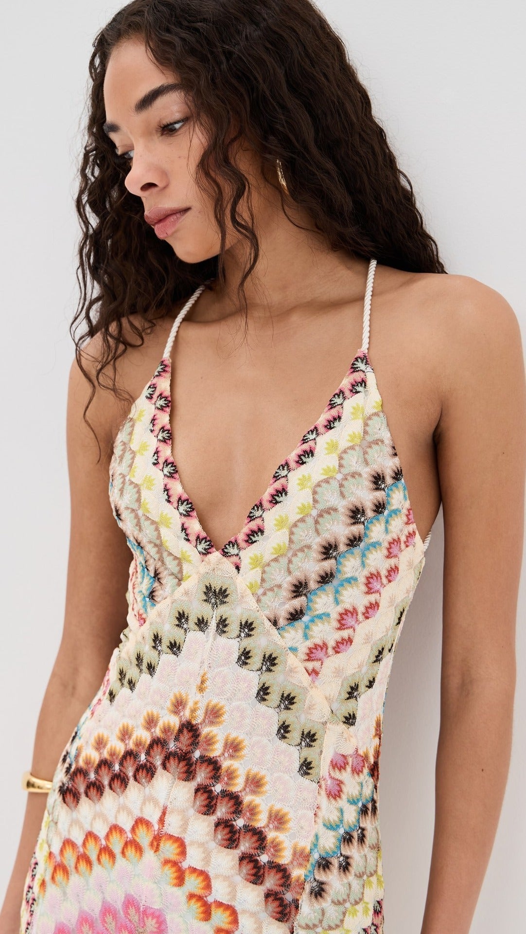Close-up of the multicolour chevron knit pattern and deep V-neckline of the maxi dress for women