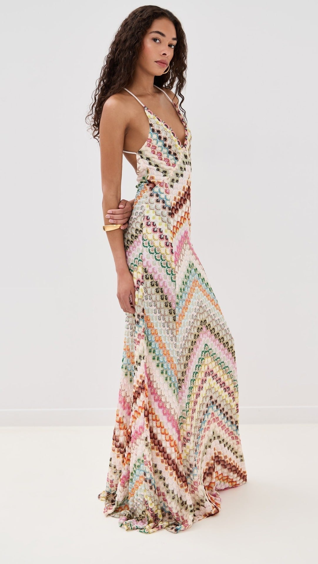 Side view of a multicolour chevron maxi dress with a flowing skirt and spaghetti straps for women