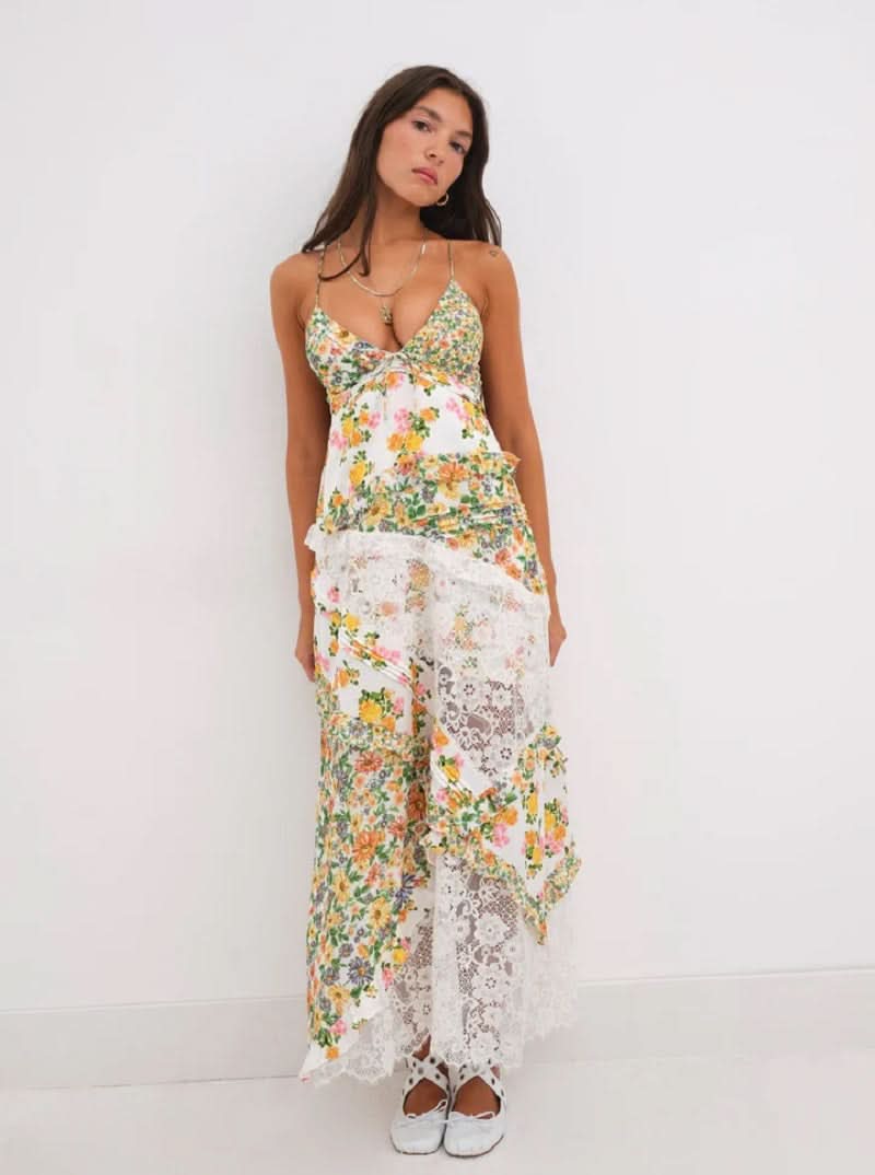 Front view of the Iris Tiered Maxi Dress in yellow and green floral print with white lace, featuring a deep V-neck and spaghetti straps.