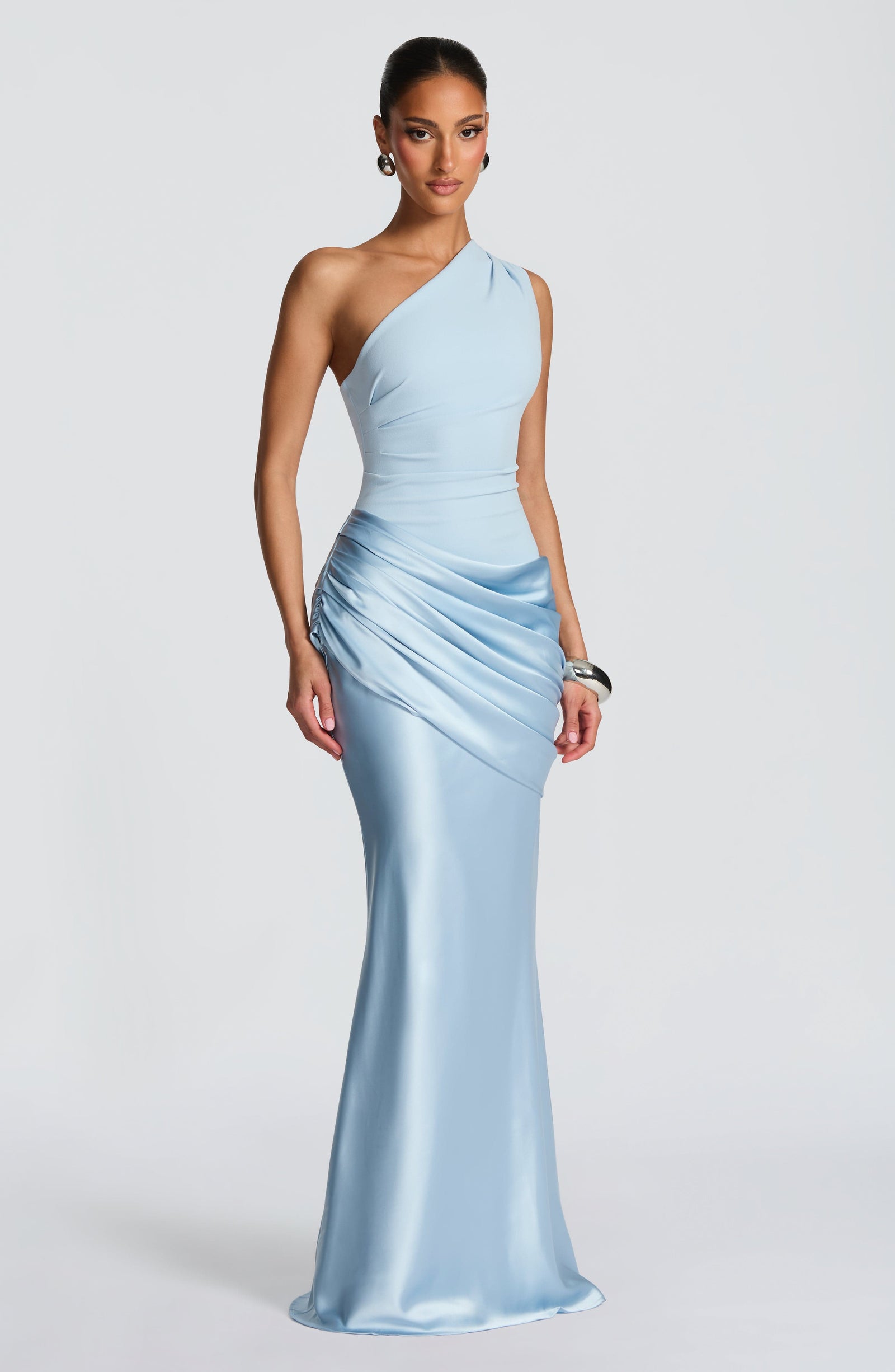 Front view of the light blue Isabelle Draped Maxi Dress, showcasing the smooth bodice and artfully ruched satin maxi skirt.