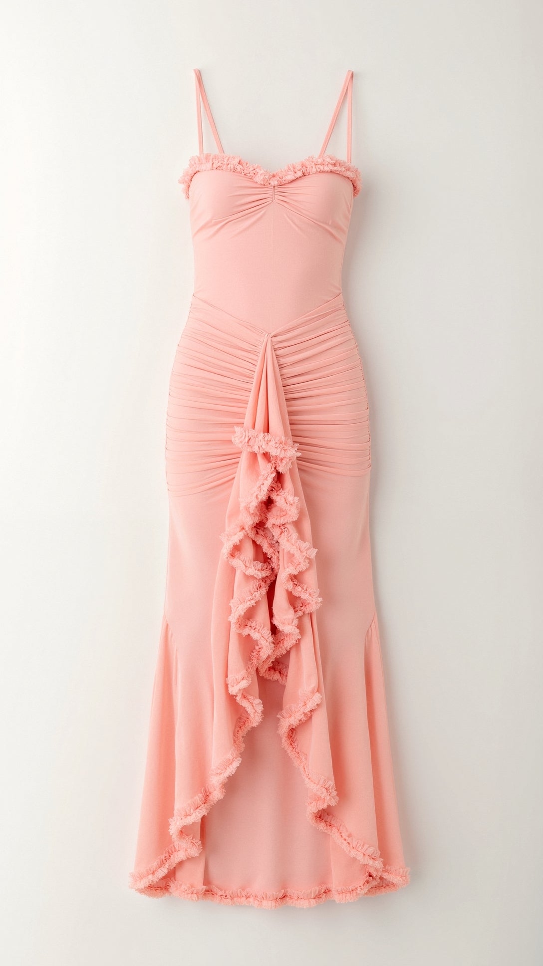 Detail shot of the peach pink Isla Ruffle Maxi Dress, highlighting the gathered fabric and intricate ruffled detailing.