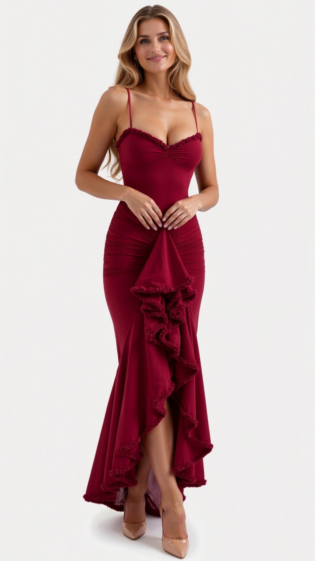 Front view of a woman in a deep red Isla Ruffle Maxi Dress, highlighting the gathered fabric and tiered ruffles.