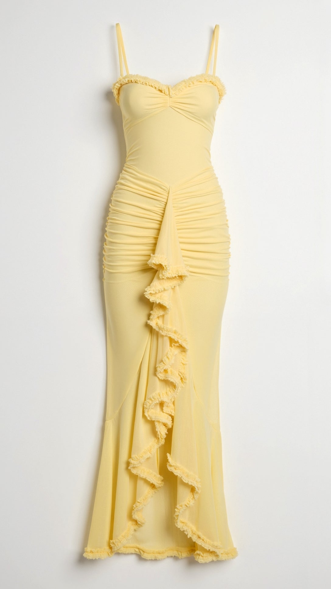 Detail shot of the yellow Isla Ruffle Maxi Dress, focusing on the ruched texture and cascading ruffles on the skirt.
