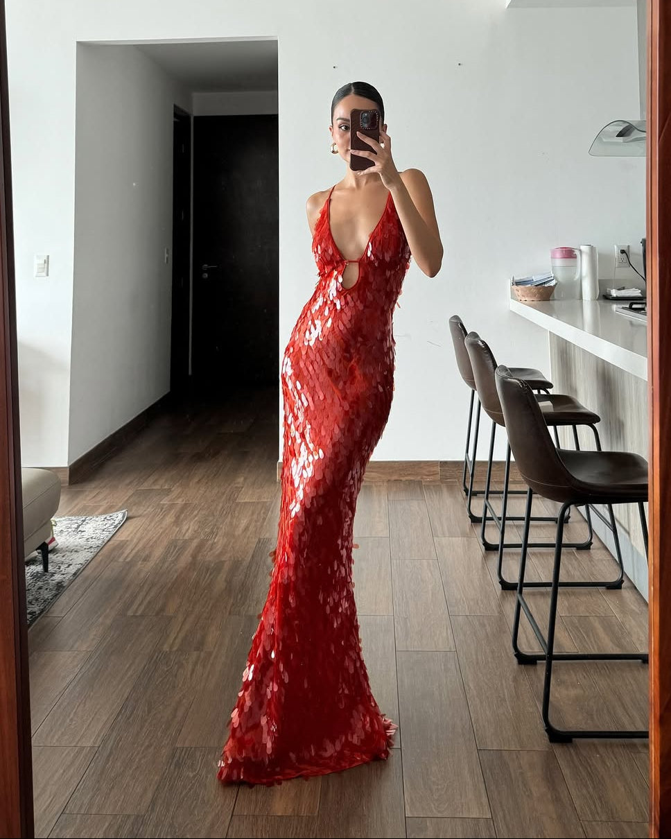 Full-length mirror selfie of the red sequin maxi dress, showing the deep v-neck, cut-out bodice, and flowing skirt.
