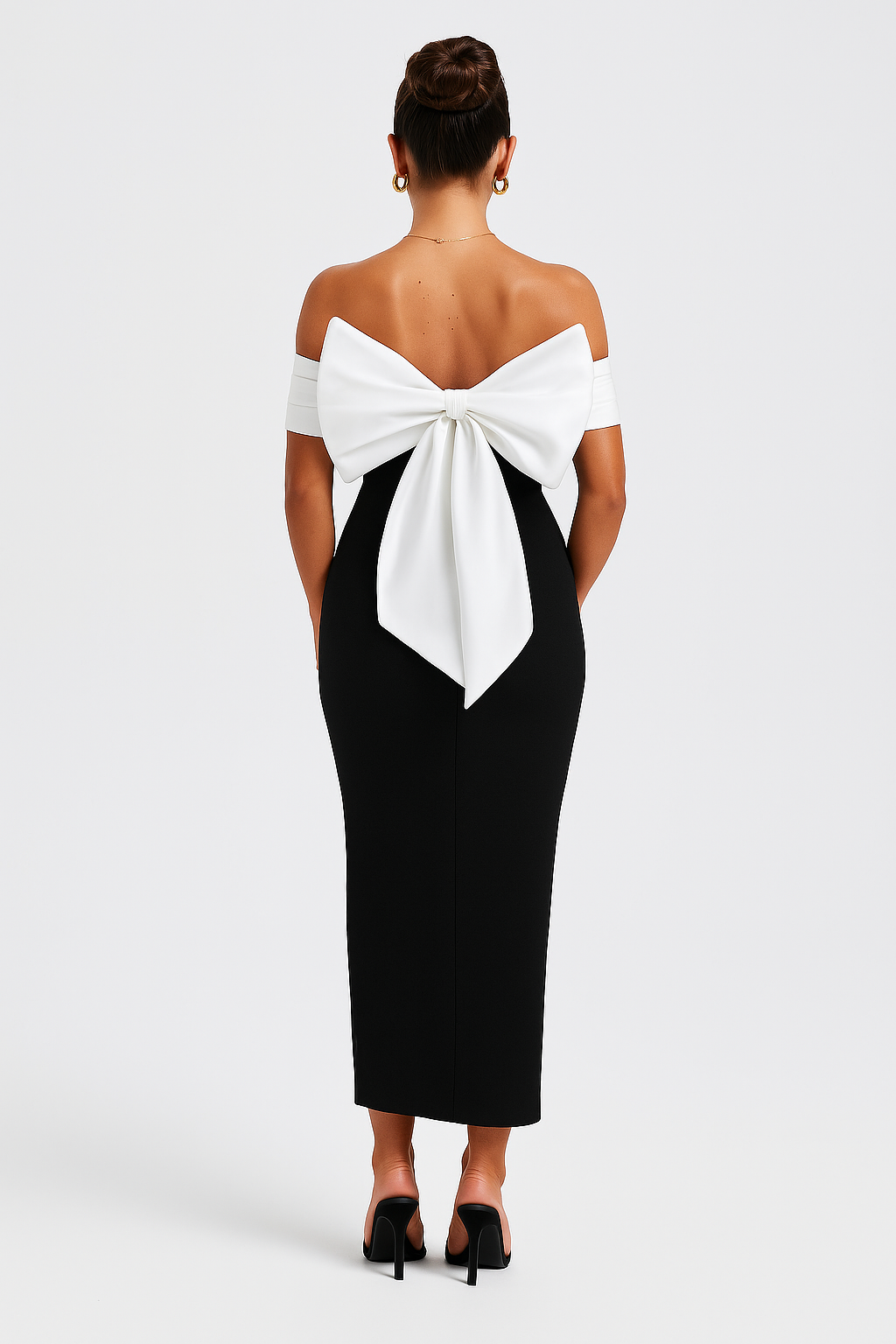 Black off-the-shoulder midi dress with a white folded neckline, form-fitting silhouette, and subtle flare at the hem.