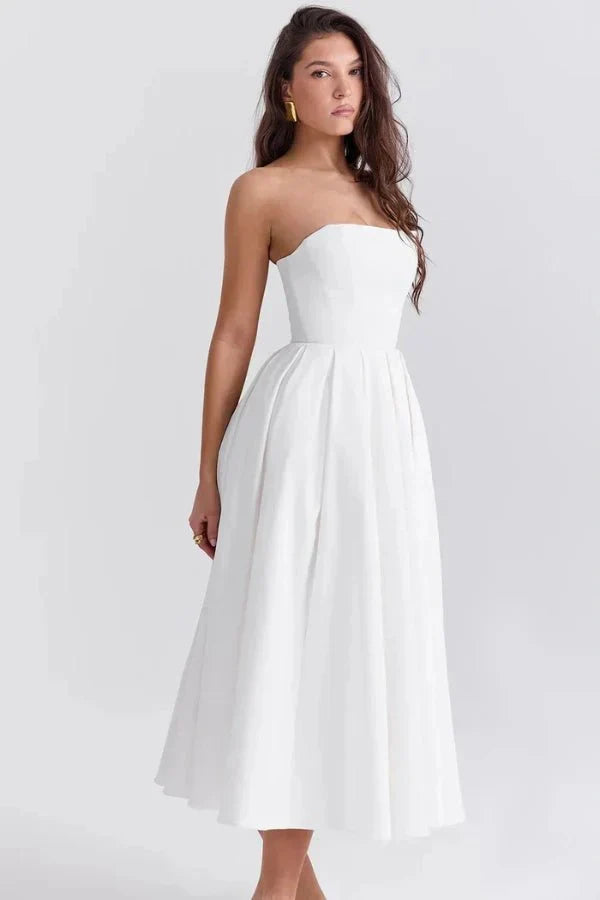 Front view of a white strapless midi dress with a fitted bodice and pleated A-line skirt, suitable for women.