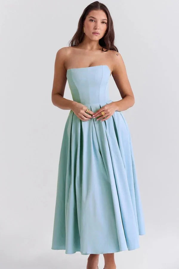 Light blue strapless midi dress featuring a fitted top and a voluminous pleated skirt.