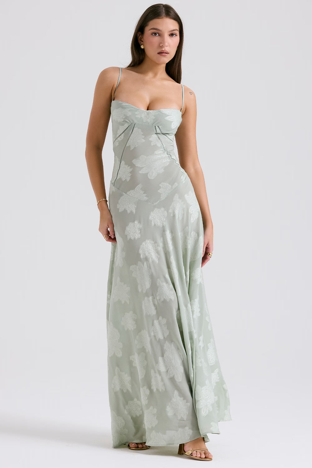 Front view of a light sage green Juliet Lace Maxi Dress with a sweetheart neckline and all-over floral lace detailing.