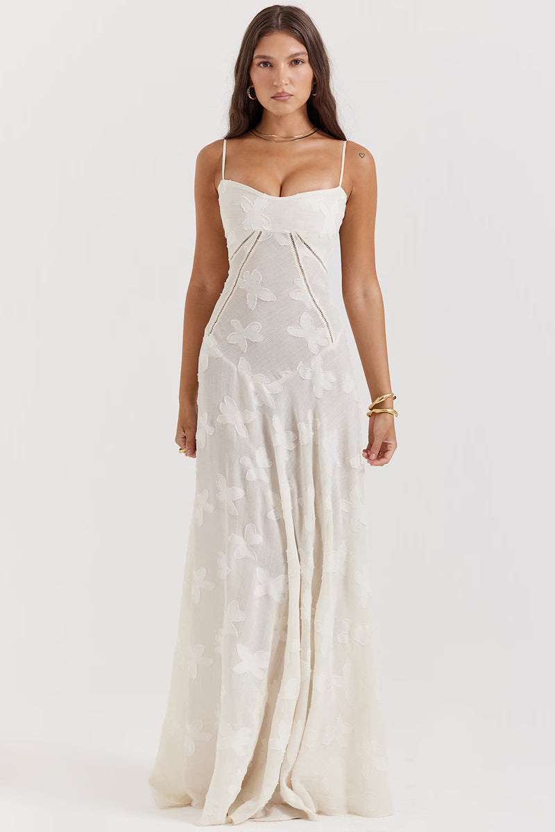 Front view of an ivory Juliet Lace Maxi Dress featuring a subtle butterfly lace pattern and slim spaghetti straps.