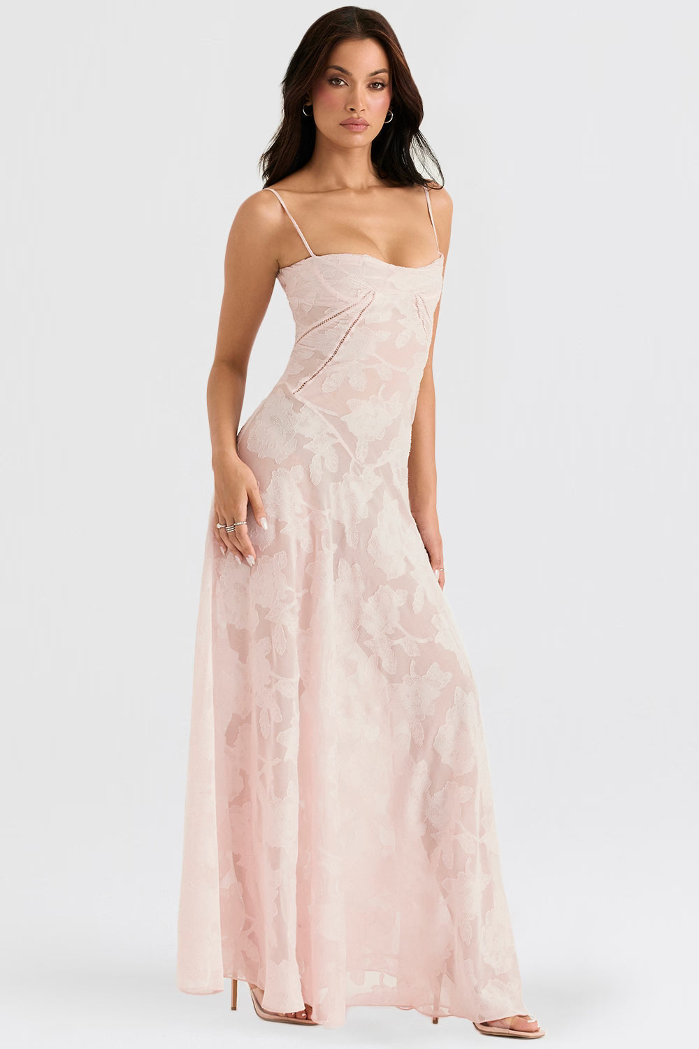 Side view of the light pink Juliet Lace Maxi Dress, highlighting the flowing skirt and fitted lace bodice.
