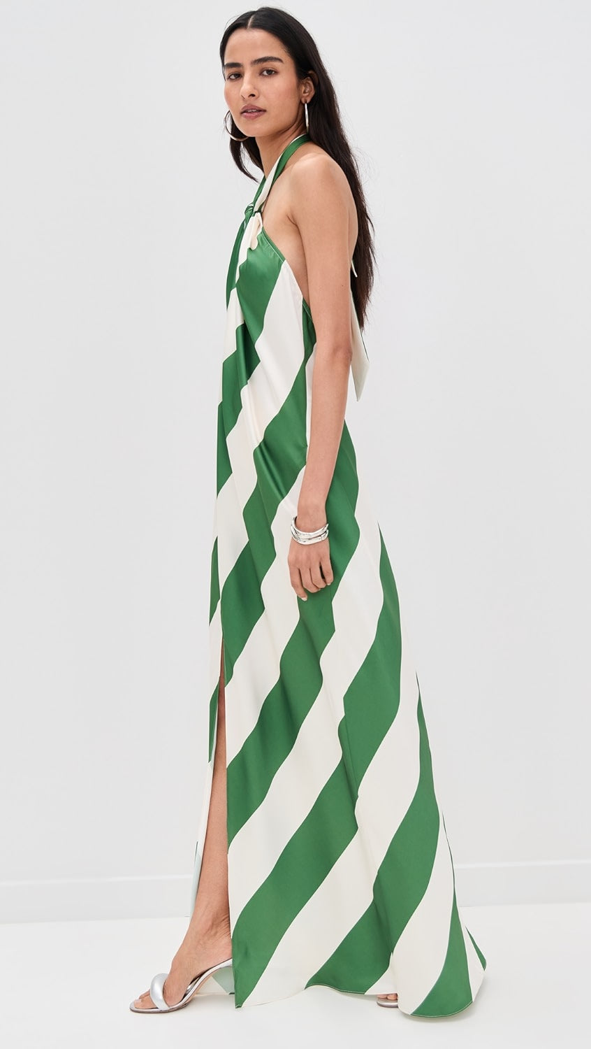 Side profile of the June Stripe Maxi Dress, highlighting the high side slit and the elegant drape of the fabric.
