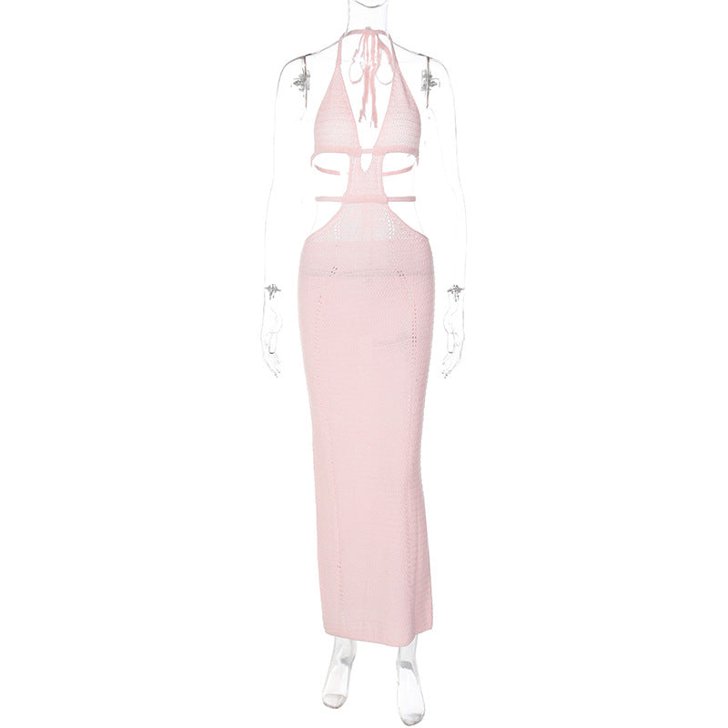 Full view of a light pink Kara Cutout Maxi Dress on a mannequin, showing the halter neck, deep V-cut, and detailed side cutouts of the knitted garment.