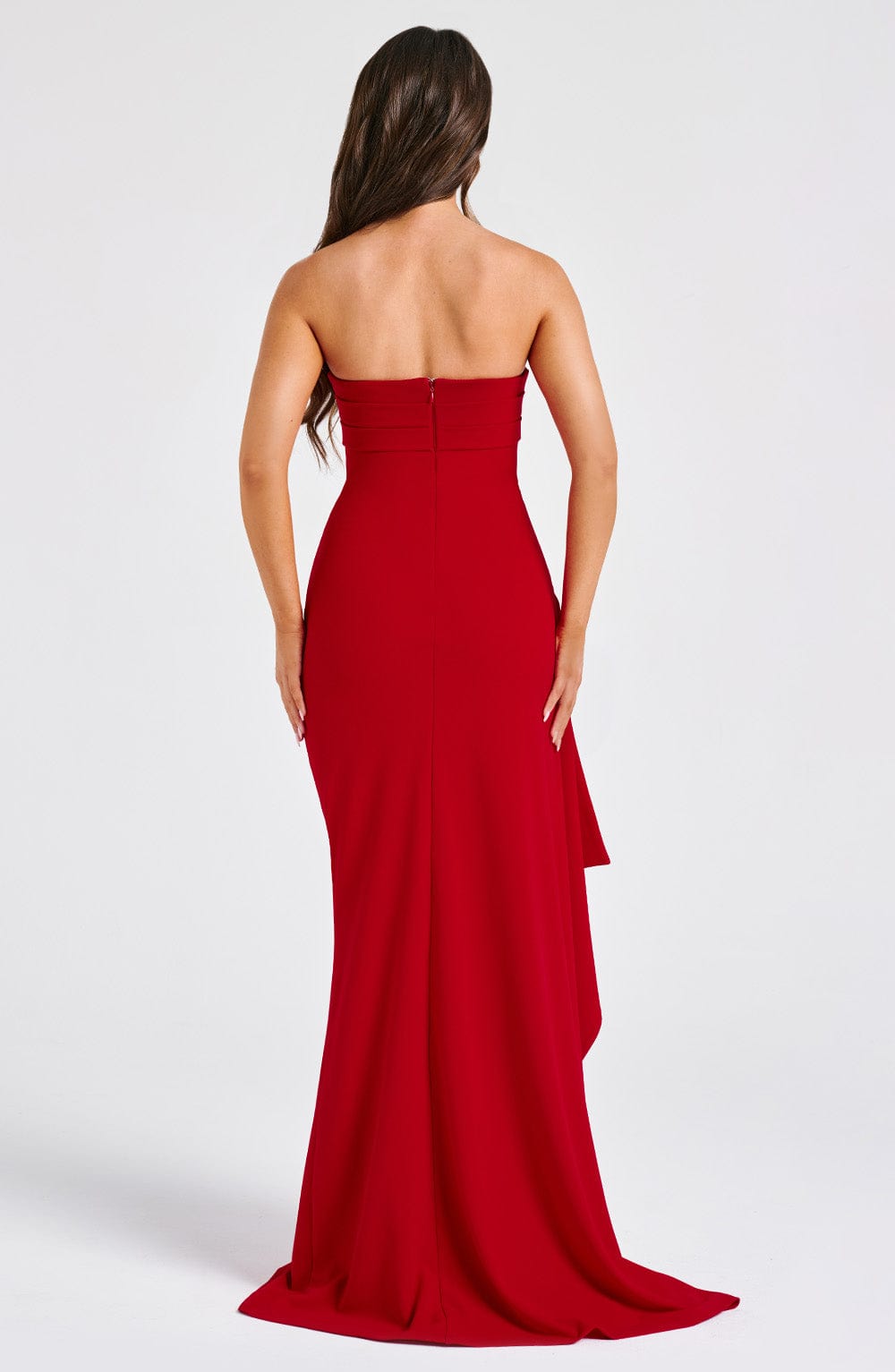 Back view of the red Kyla Draped Maxi Dress, showing the subtle zipper closure and the elegant flow of the skirt.
