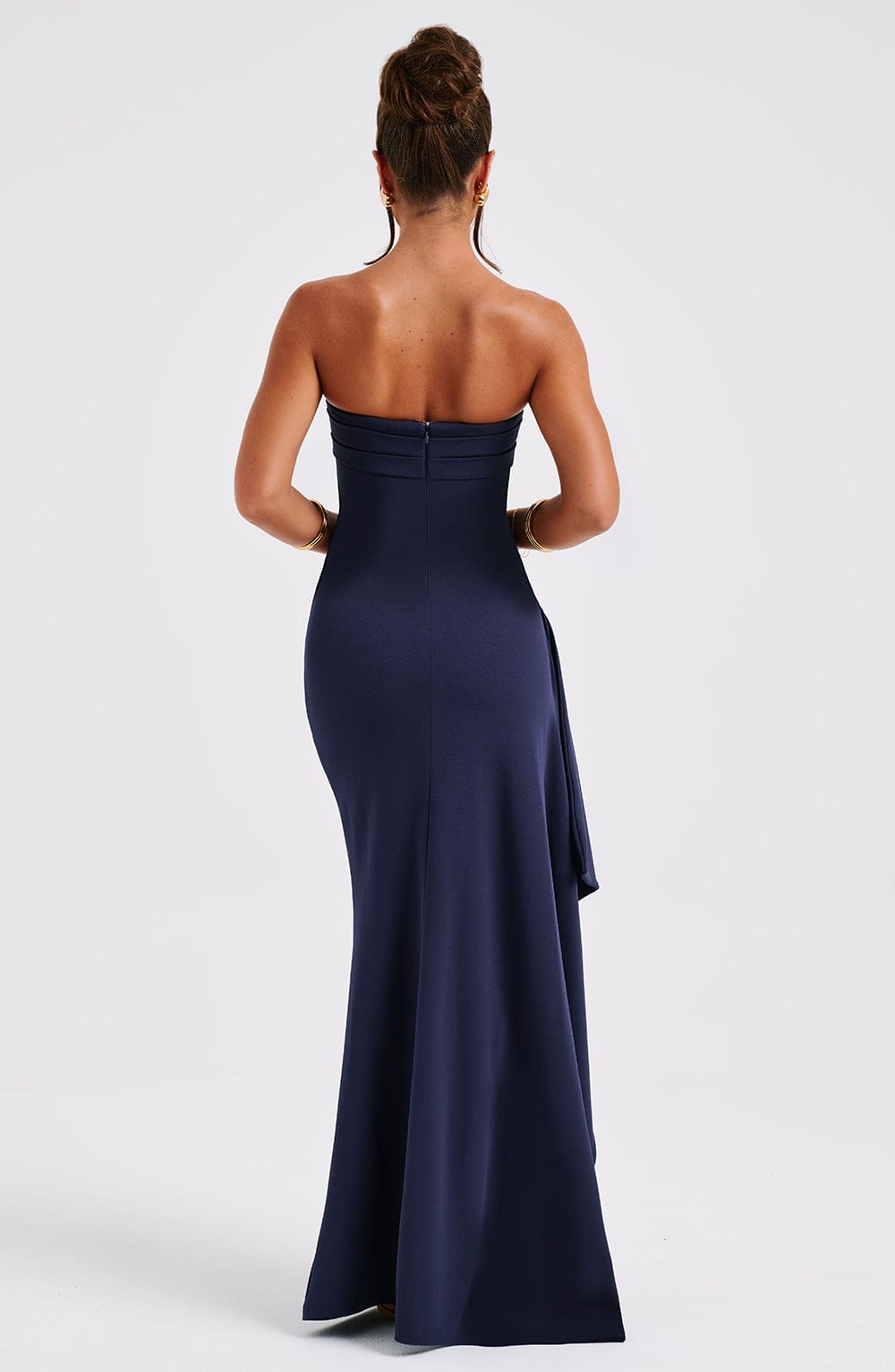 Back view of the navy blue strapless maxi dress, showing the sleek fit and subtle zipper closure, suitable for dress suits for women.