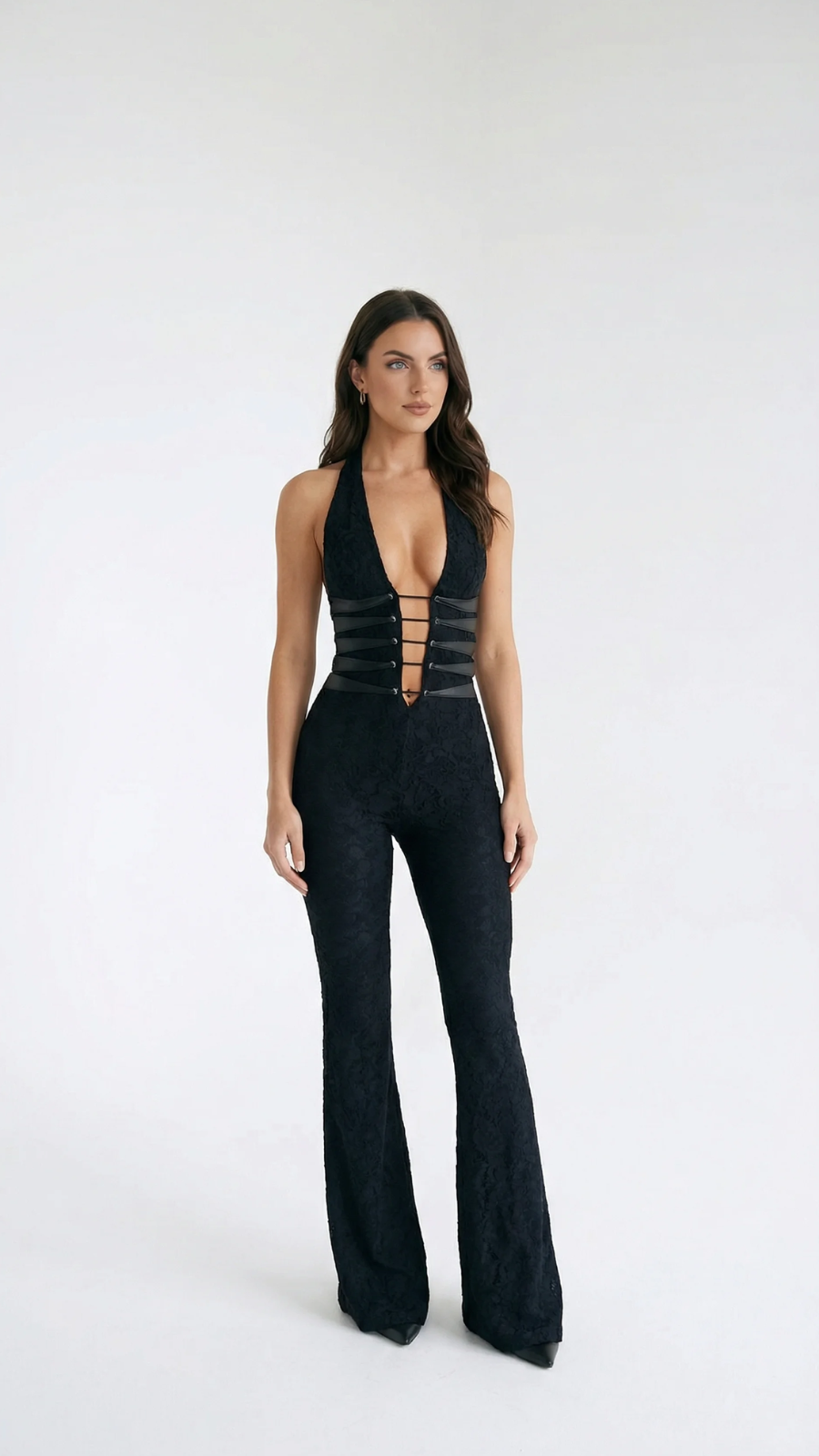 Black lace halter jumpsuit with a deep V-neck and strap detailing, featuring flared pants.