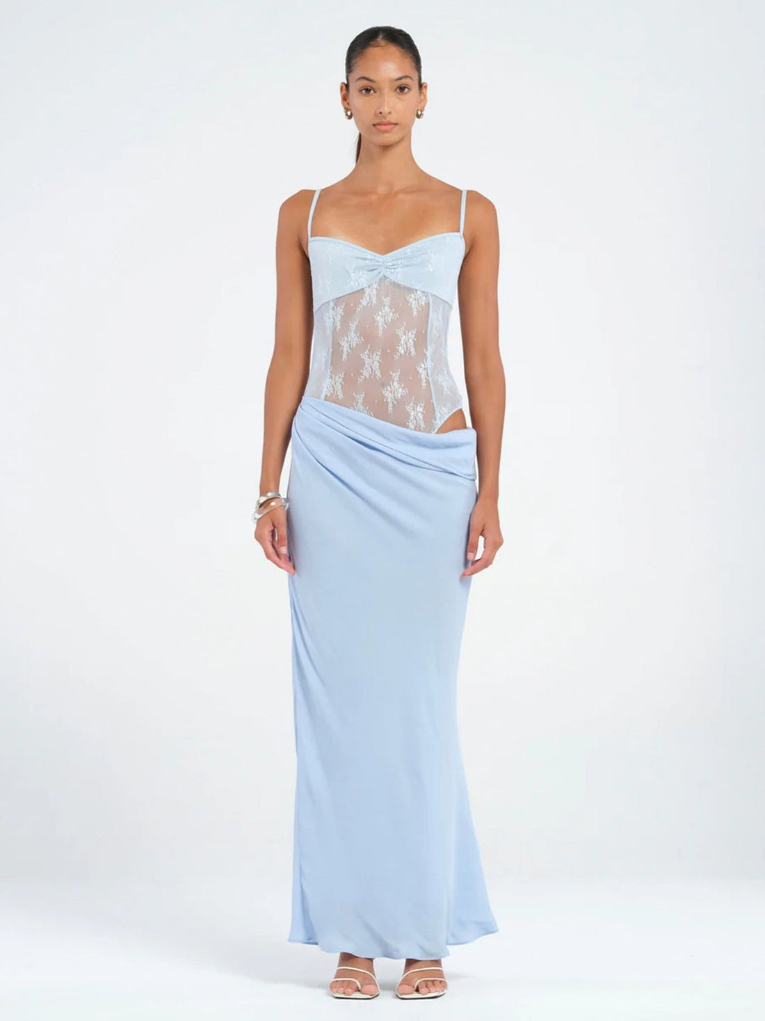 Full-length black lace maxi dress with draped skirt detail and sweetheart neckline, spaghetti straps