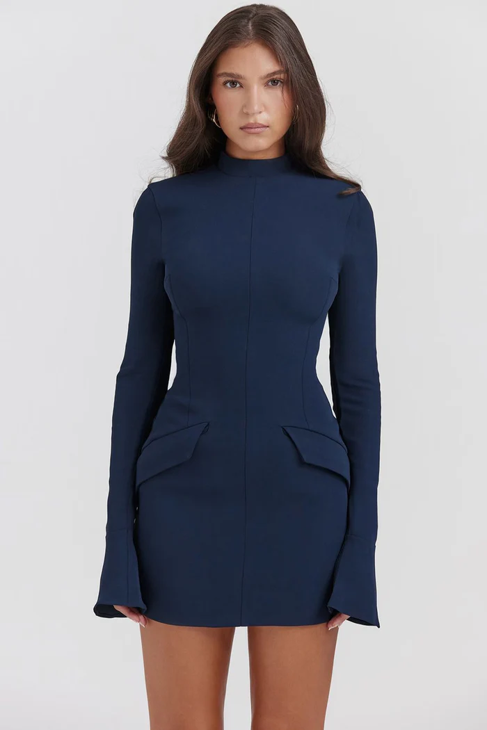 Navy blue structured mini dress with long sleeves, high neck, and tailored hip pockets, offering a sophisticated silhouette.