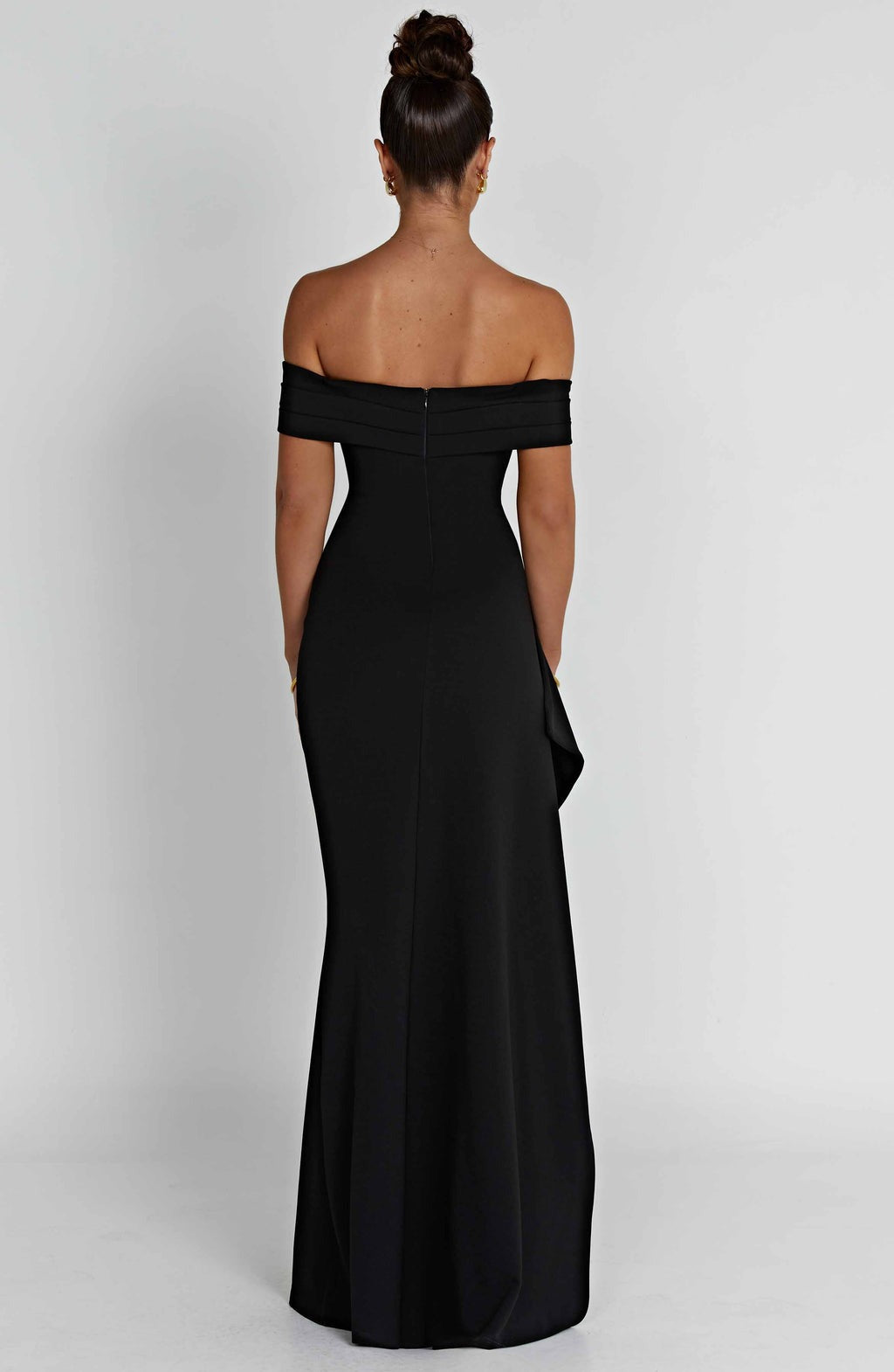Back view of a black off-the-shoulder maxi dress, showing the elegant cut and floor-length design.