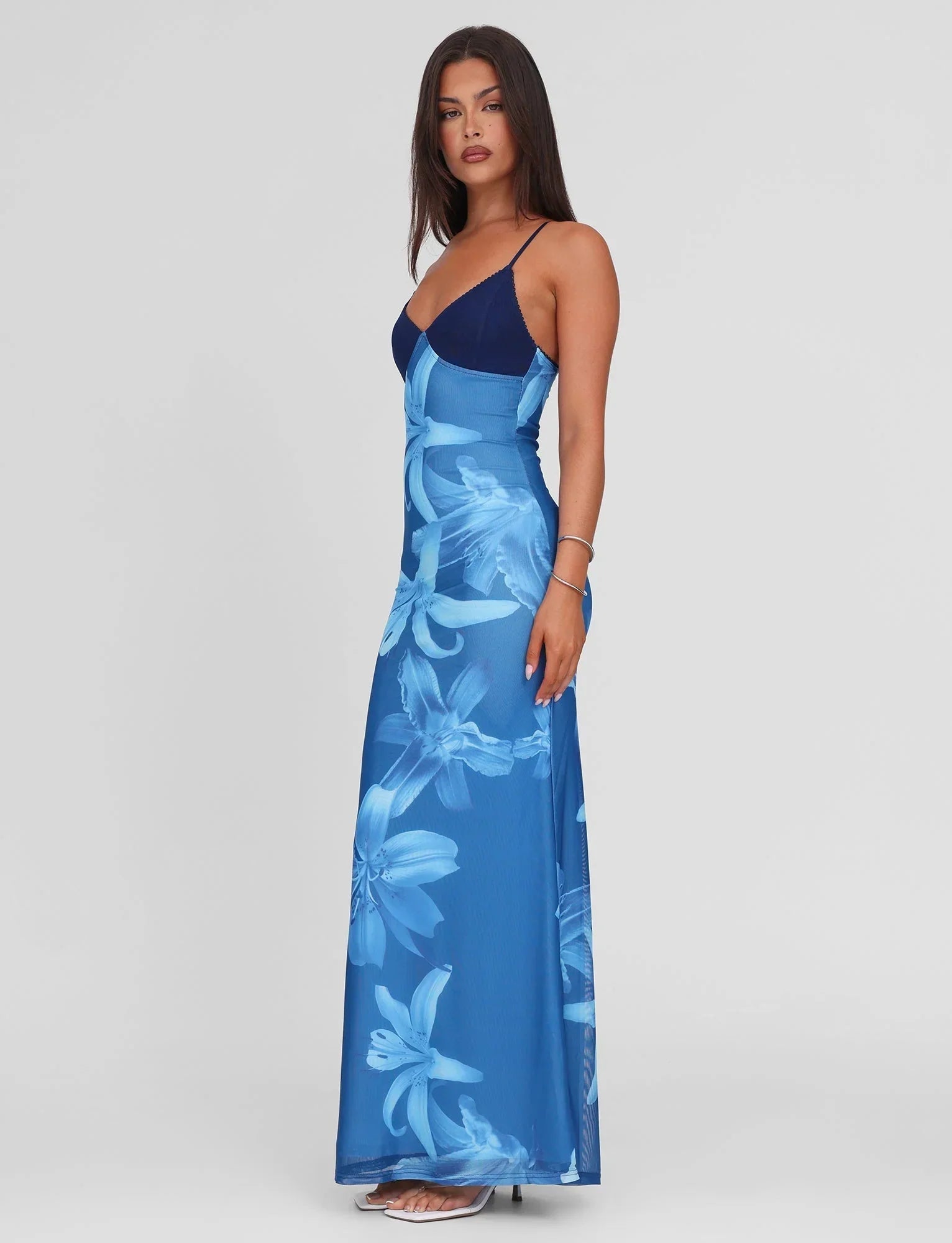 Side view of blue floral maxi dress showing flowy silhouette for women