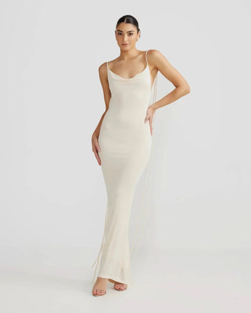 Off-white backless cowl neck maxi dress with tie straps on a model, front view for women