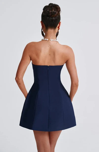 Back view of the navy blue strapless bubble mini dress, showing the discreet zipper closure and A-line silhouette.
