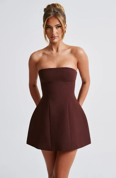 Full front view of the brown strapless bubble mini dress, highlighting the elegant simplicity and flattering cut of the dress.