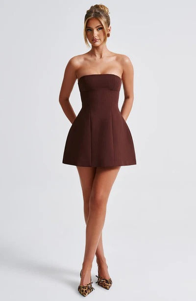Deep brown strapless mini dress with a chic fitted top and a flared bubble skirt, perfect for any event.