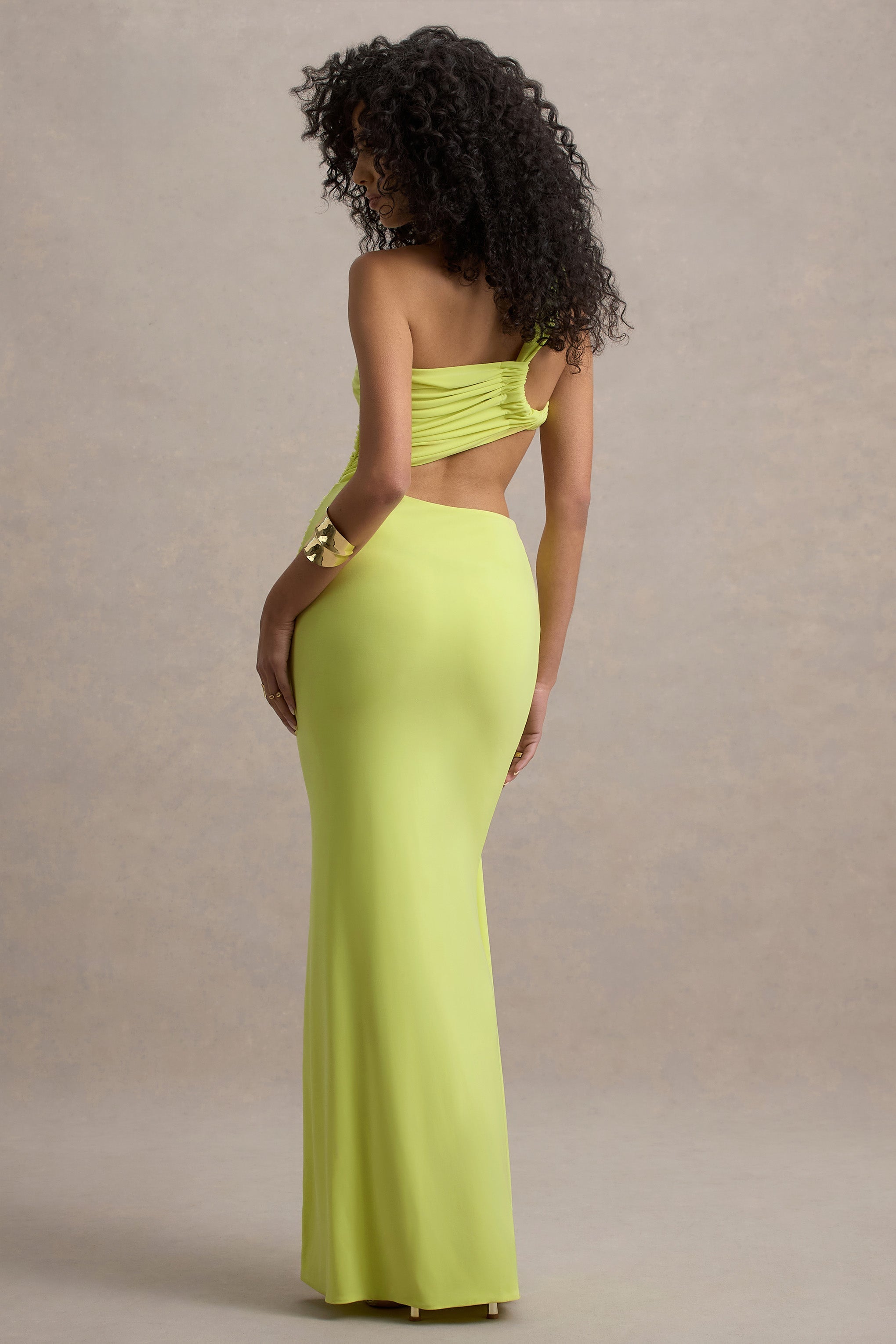 Back view of the neon yellow Lorelei Cutout Maxi Dress, highlighting the open back design and form-fitting maxi skirt.