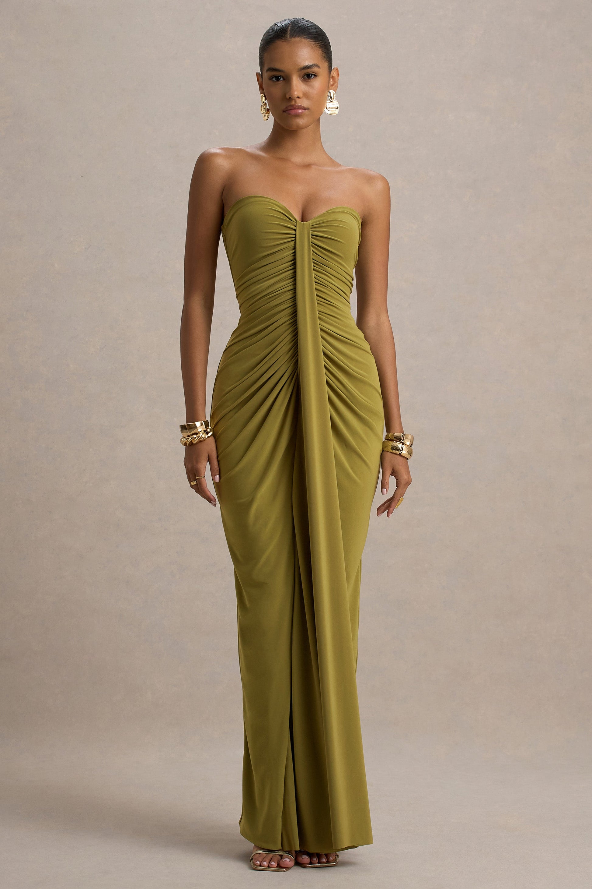 Full-length view of a strapless olive green ruched maxi dress with a sweetheart neckline and center draping.