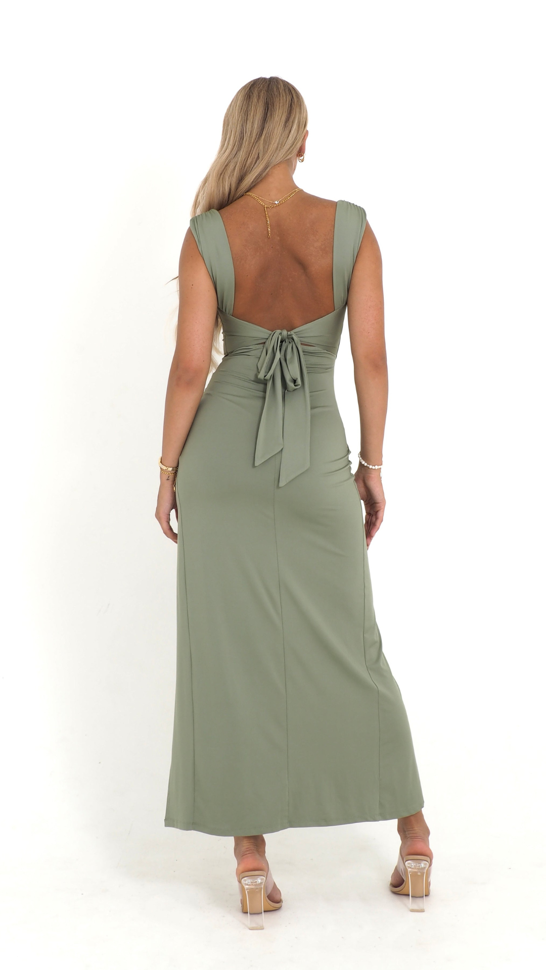 Back view of the Mackenzie Bow Maxi Dress, displaying the low back with a delicate tie-bow closure.