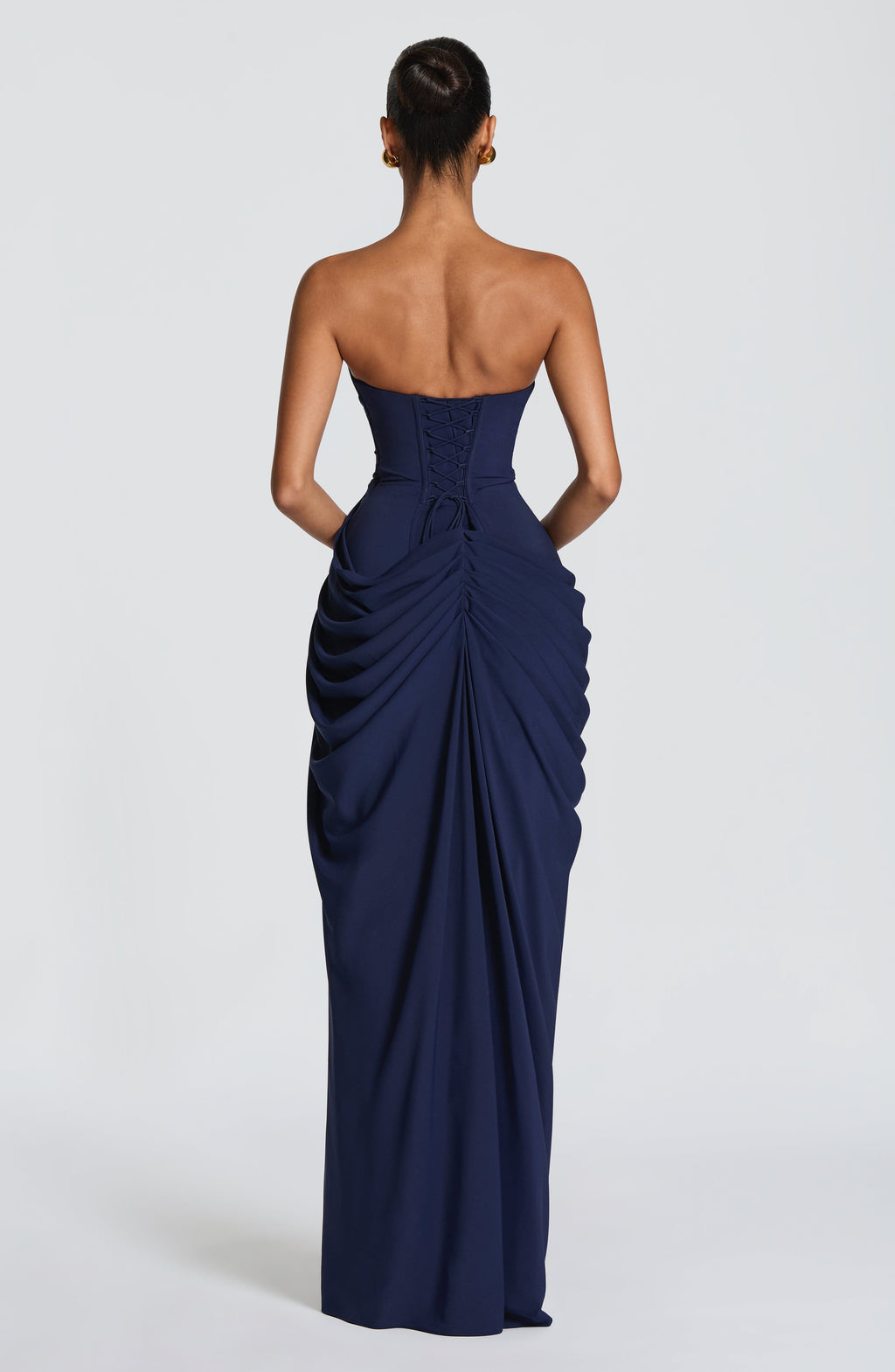 Back view navy ruched maxi dress with strapless neckline and corset lace-up detail