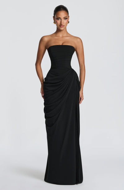 Black strapless ruched maxi dress with draped hip ruching and straight skirt, front view